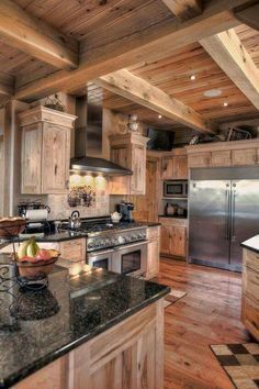 a kitchen with wooden cabinets and granite counter tops is shown on the instagram page