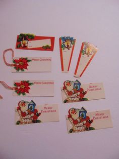 several christmas cards with santa clause on them