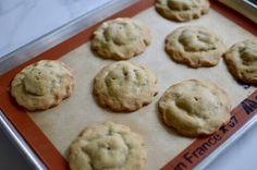 freshly baked cookies sitting on a baking sheet