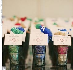 small cupcakes are lined up on the table for guests to sit down at