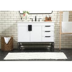 a bathroom with white brick walls and a wooden cabinet in the middle, along with a rug on the floor