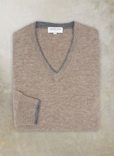 Experience the luxury and warmth of our Melbourne V-Neck Merino Wool Sweater. Crafted from 100% Extra Fine 2-ply Merino Wool yarn from Australia, this sumptuous sweater offers warmth, softness and luxury to every day dressing. Unique details such as the subtle contrast at the neckline bring upscale luxury to a timeless, every-day piece. • 100% Extra Fine Merino Wool • Dry clean or hand wash, dry flat • Imported • Item # WL-2006W-TUP Fine Knit Merino Wool V-neck Sweater For Work, Fall Merino Wool V-neck Sweater, Cozy V-neck Merino Wool Sweater, Fine Knit Merino Wool V-neck Sweater, Luxury Classic Merino Wool V-neck Sweater, Merino Wool Clothing, Merino Wool Yarn, Wool Clothing, Sweater Collection