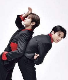 two young men in black and red outfits