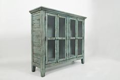 an old wooden cabinet with glass doors