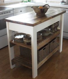 a kitchen island with plates and bowls on it