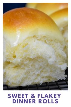 a close up of two rolls on a cooling rack with the words sweet & flaky dinner rolls