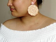 "Handmade hand-embroidered Statement Flower Earrings. Purely hand-embroidered oversized thread and beads earring. These Earrings look awesome for the spring-summer. Earrings measure about approx. 3 \" in diameter. Available here in four colors: White Red Yellow Peach Blue Each Carnation jewellery piece is handmade and handcrafted in India. PS: Please note, Since our product is purely handmade in nature hence a slight imperfection may be there. The colours and patterns may slightly vary from the Handmade Beige Jewelry For Spring, Beige Flower Jewelry For Summer, Summer Beige Flower-shaped Jewelry, Handmade Beige Flower-shaped Earrings, Handmade Beige Flower Earrings As Gift, Handmade Beige Flower Earrings For Gift, Handmade Flower Earrings For Summer Weddings, Handmade Summer Wedding Flower Earrings, Summer Wedding Handmade Flower Earrings