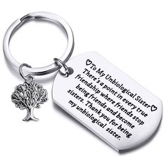 a keychain with a tree on it that says, i am an unholled friend