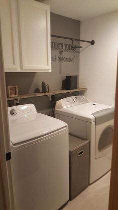 a washer and dryer sitting in a laundry room next to eachother