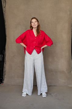 "A stylish oversize shirt with practical ¾ sleeves ended with cuffs. The shirt is designed to have a relaxed fit having a casual collarless silhouette. A dainty V-neck elongates the length of the neck. The shirt is decorated with big front pockets and nice noteworthy organic coconut buttons. The garment can be perfectly combined with various types of pants whether you prefer skinny or wide-leg designs. DETAILS ⚬ Decorated with handmade stitches. ⚬ V-neck. ⚬ Chest patch pockets. ⚬ 3/4 sleeves. ⚬ Red Linen Pants, Brown Linen Pants, Thrift Style, Linen Outfits, Oversized Linen Shirt, Linen Pants Outfit, Linen Tunic Dress, Black Linen Dress, Linen Blouse