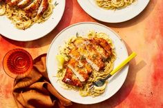 three plates of pasta with chicken and sauce