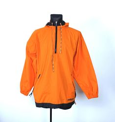 Neon orange adidas anorak with built-in hood, pockets and tensioners. Garment with some signs of use, reflected in the last 2 photos. Condition: Used. Type: Jacket Color: Orange Size: US Medium. Check Measurements before buying. Material: Polyester. Flat measurements (centimeters) 60cm shoulder to shoulder 23.6inch 64 cm armpit to armpit 25.2 inch. 81 cm from neck to end of sleeve 31.8 inch. 52 cm from armpit to end of sleeve(inside) 19.7 inch. 79 cm total length 31.1 inch. SHIPPING: We ship ite Adidas Orange, Hot Orange, European Countries, European Union, 2 Photos, Neon Orange, Color Orange, Adidas Jacket, Tracking Number