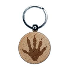 a wooden keychain with a hand print on the front and back of it