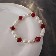 Pearls are known for their roundness, fullness and warm color, adding a touch of gentleness and nobility to the wearer. Red crystals are carefully cut to create square facets that sparkle in the sunlight or light. Red crystals not only symbolize passion and vitality, but also happiness and good fortune, bringing positive energy to the wearer. Red crystal bead measure approx. 8mm big, and freshwater pearls measure approx. 6mm big. Each natural freshwater pearl is unique, their size and shape migh Handmade Elegant Red Crystal Bracelet, Elegant Red Beaded Bracelets For Valentine's Day, Elegant Handmade Red Crystal Bracelet, Elegant Red Beaded Bangle Bracelet, Elegant Red Crystal Bracelet As Gift, Elegant Red Crystal Bracelet For Valentine's Day, Elegant Red Round Crystal Bracelet, Real Pearl Jewelry, Real Pearl Jewellery