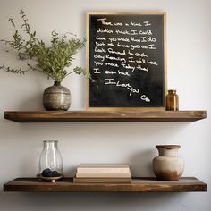 two vases and a chalkboard on a shelf