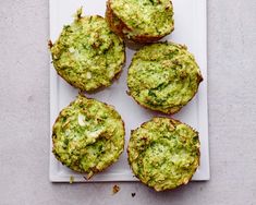 broccoli and cheese muffins on a white plate