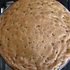 a cookie cake sitting on top of a stove