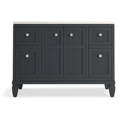 a black cabinet with four drawers and two doors