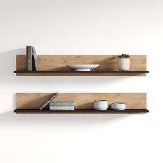 two wooden shelves with bowls and books on them