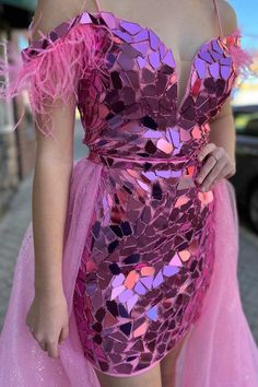 a woman in a pink and purple dress