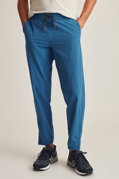 The Crossover Jogger Sweatpants | Bonobos | Bonobos Blue Recycled Polyester Sports Bottoms, Sporty Comfort Stretch Activewear For Outdoor, Functional Outdoor Bottoms With Drawstring, Sporty Nylon Pants With Drawstring, Athleisure Outdoor Pants With Drawstring, Casual Activewear With Comfort Stretch For Outdoor Activities, Sporty Pants With Elastic Waistband In Recycled Polyester, Functional Outdoor Activewear With Elastic Waistband, Versatile Recycled Polyester Bottoms With Pockets