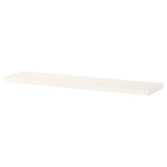 a white shelf sitting on top of a wall