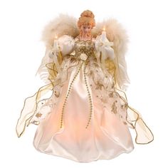 an angel figurine with white and gold feathers on it's head, holding two candles