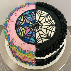 a cake with sprinkles and spider web on it