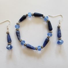 a bracelet and earring set with blue beads