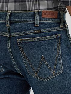 A SLIMMED-DOWN CLASSIC Designed to go with everything in your closet, our Men's Slim Fit Bootcut Jean provides the perfect mix of comfort and style. Better than classic, these bootcut jeans are crafted from a comfortable cotton blend with just a hint of stretch for added flexibility. They come with the signature five-pocket styling, "W" embroidery, a slim fit through the thigh, and a bootcut leg opening that looks great with any shoe. Bootcut Jean, Wrangler Jeans, Slim Fit Men, Bootcut Jeans, Men's Jeans, Classic Design, Mens Jeans, Looks Great, Jeans Size