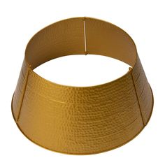 a gold colored lamp shade on a white background with clippings for the bottom