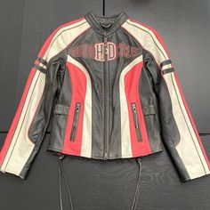 Harley-Davidson Women’s Ridgeway Black White And Pink Leather Jacket. Beautiful Harley-Davidson Pink, Black, And White Leather Riding Jacket. Stunning Laced Side Details. Worn Only One Time. Great Condition. Great Quality. Size Xs, True To Size, Measurement Shown In Photos. Limited Edition Seasonal Item - Super Rare! Harley Jacket, Leather Riding Jacket, Harley Davidson Leather Jackets, Cafe Racer Leather Jacket, Harley Davidson Clothing, Motorcycle Jacket Women, Casual Leather Jacket, Leather Coat Womens, Pink Leather Jacket