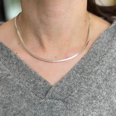 Sterling silver hard/ somewhat flexible, rhin, oval, open collar neck wire necklace. Measures around: 15" No clasp; open back Width: 2.70mm Weight: 14.70 grams Stiff collar Minimalist Necklace With Sterling Silver Oval Link Clasp, Modern Oval Link Chain Necklace With Sterling Silver Clasp, Silver Necklace With Sterling Silver Clasp And Oval Link, Silver Oval Link Metal Necklace, Nickel-free Adjustable Oval Pendant Necklace, Collar Neck, Silver Flats, Wire Necklace, Collar Necklace