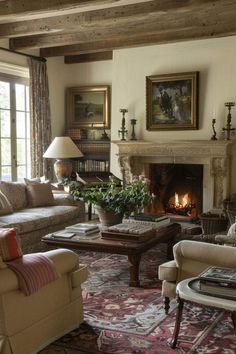 a living room filled with furniture and a fire place in the middle of a room