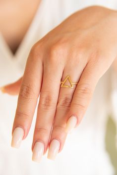 "✦Dainty Gold Triangle Ring! BAND DETAILS ✦Triangles sides are is 0.41\"(inches) or approx. 10.41mm. ✦Band's thickness is 0.046\" (inches) or approx. 1.19mm. MATERIALS ✦Available in 9K and 14K and also in Yellow Gold,Rose Gold or White Gold. ✦Ring will be shipped in a jewelry box and bag. ✦IMPORTANT NOTE! All import duties and taxes are the buyer's responsibility, this is not calculated in the price. ✦We ship worldwide with FeDex,so please message us with your telephone number. R E T U R N S ✦Al Treble Clef Necklace, Modern Bangle, Handmade Gold Ring, Dainty Gold Bracelet, Gold Pearl Ring, Gold Triangle, Triangle Ring, Symbolic Jewelry, Solid Gold Ring