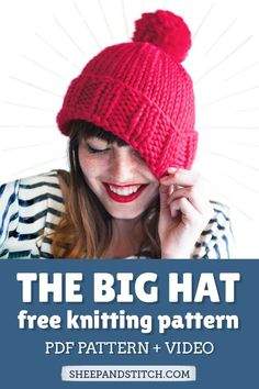 a woman wearing a red knitted hat with text overlay reading the big hat free knitting pattern