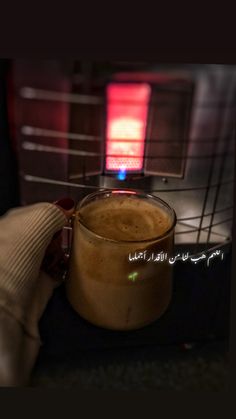 a cup of coffee sitting on top of a counter