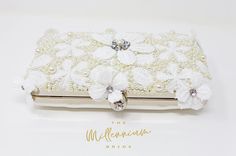 New to our Millennium collection, This beautiful romantic WHITE LACE FLORAL crystal bridal clutch bag is made of very fine quality of fabric and metal and it comes with two chains, one chains length is 15 inches for a shoulder bad 44 inches long cross body bag Detachable chain for your Big day! ► ABOUT YOUR ORDER * All items are neatly packaged in our beautiful jewelry boxes and elegant organza bags. * All items are 100% gift-ready. * Each order comes with a personalized handwritten card and a branded Millennium Bride jewelry cloth. * Each order comes with a free gift. ► PERSONALIZTION * If your order is a gift, you may contact us with the recipient's name or a message, and we'll print a personalized card that will be elegantly packaged with your order. We'll also personalize the free gift Elegant Bridal Accessories With Pearl Embroidery For Ceremony, White Embroidered Rectangular Evening Bag, Pearl White Rectangular Wedding Bag, Rectangular Embroidered Evening Bag For Wedding, White Clutch With Pearl Embroidery As Gift, White Handheld Evening Bag For Formal Occasions, Elegant White Evening Bag For Wedding, Elegant Embroidered Bridal Accessories For Wedding, White Bridal Accessories With Pearl Embroidery For Formal