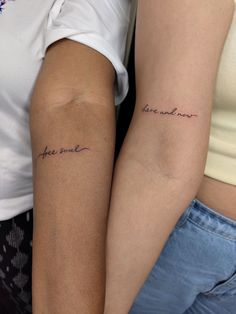 two people with tattoos on their arms that say, hope and love are in cursive writing