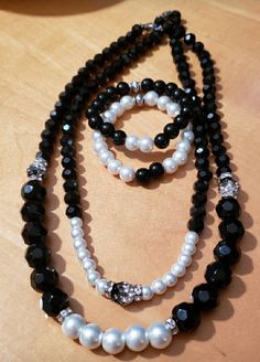 Black and white beads with rhinestone accents 2 necklaces and 2 bracelets White Beaded Jewelry, Jewellery Sets, White Beads, Jewelry Set, Favorite Jewelry, Jewelry Sets, Beaded Jewelry, Handmade Items, Bathing Beauties