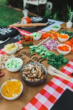 a picnic table with various foods on it