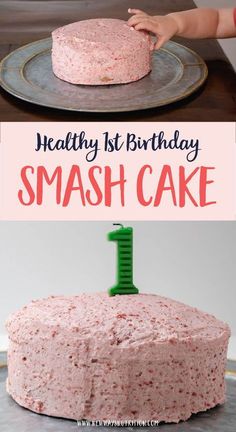 a cake with pink frosting sitting on top of a metal pan next to a child's hand