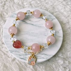 📝Material and Size Rose Quartz Beads: around 12mm Red Heart Bead is Strawberry Quartz 14k Gold Filled decoration beads Clear bead is Xilion Bicone (Also name as Swarovski crystal) Bracelet length: around 14cm 💜You will receive the exactly same bracelet as shown in the photo. 💜This handmade Jewelry listing come with an anti-oxidized jewelry box. 💜Please ensure you have no metal allergy before purchasing 💜Keep in mind these are natural stones and they may have small cracks and imperfections. Rose Gold Crystal Bracelet With Round Beads Gift, Heart Bracelet With Round Beads As Gift, Heart Beads Bracelet Gift, Rose Gold Bracelets With 8mm Beads For Gift, Rose Gold 8mm Beads Bracelet For Gift, Rose Gold 8mm Beads Bracelet As Gift, Spiritual Rose Gold Beaded Bracelets Gift, Rose Gold Jewelry With 8mm Beads For Gift, Elegant Pink Heart Beaded Bracelets