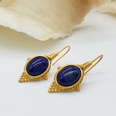 Our Egyptian Revival collection, featuring real lapis cabochons and beads, is inspired by a necklace that was made in the Castellani workshop. In ancient Egypt, lapis was highly regarded as a stone of celestial origin and as a symbol for truth. Materials: lapis cabochon, pewter with gold finish Overall length: 1 1/2" Gift box included From the collection of the Walters Art Museum Symbol For Truth, Original Necklace, Egyptian Revival, Gemstone Cabochons, Ancient Jewelry, Ancient Egypt, Gold Finish, Art Museum, Egypt