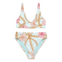 Stand out from the crowd this summer in this chic and stylish bikini with a pattern of gold chains and pink flowers against the softest light blue background. Removable pads and its double-layer make it comfy to wear all day by the pool or at the beach. This design is an Artwork by Lili original and is only available in our online store. • Fabric composition in the EU: 88% recycled polyester, 12% elastane • Double-layered and non-reversible • Removable padding • Tear-away care label • Zig-zag st Store Fabric, Light Blue Background, Care Label, A Pattern, Fabric Store, The Pool, Soft Lighting, Blue Background, Blue Backgrounds