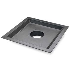 a square metal tray with holes in the center on a white background, top view