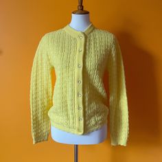 "1960s Baby Yellow Cardigan 🐥 by Bernice Creations. 100% Orlon acrylic. Super darling! See measurements to ensure desired fit. MEASUREMENTS: *taken flat WHILE BUTTONED, double where needed* TOTAL LENGTH: 23\" CHEST: 17\" WAIST: 17\" BOTTOM HEM: 16\" SHOULDERS: 16\" SLEEVE LENGTH: 24\" CONDITION: Good vintage shape. Some pilling due to age! SHOP POLICY: Thank you for your interest! All sales completed with Sunny Girlfriend Retro are final. Buyers are responsible for checking measurements of garm Fitted Vintage Knit Outerwear, Vintage Spring Sweater With Buttons, Retro Knit Sweater With Buttons, Vintage Knit Outerwear With Buttons, Vintage Knit Outerwear With Button Closure, Fitted Button-up Retro Cardigan, Retro Fitted Button-up Cardigan, Retro Fitted Knitted Outerwear, Retro Fitted Knit Outerwear