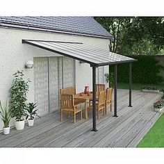 an outdoor patio with table and chairs