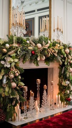 a fireplace decorated for christmas with candles and greenery