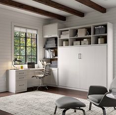 a living room filled with furniture next to a window covered in windows and wooden beams